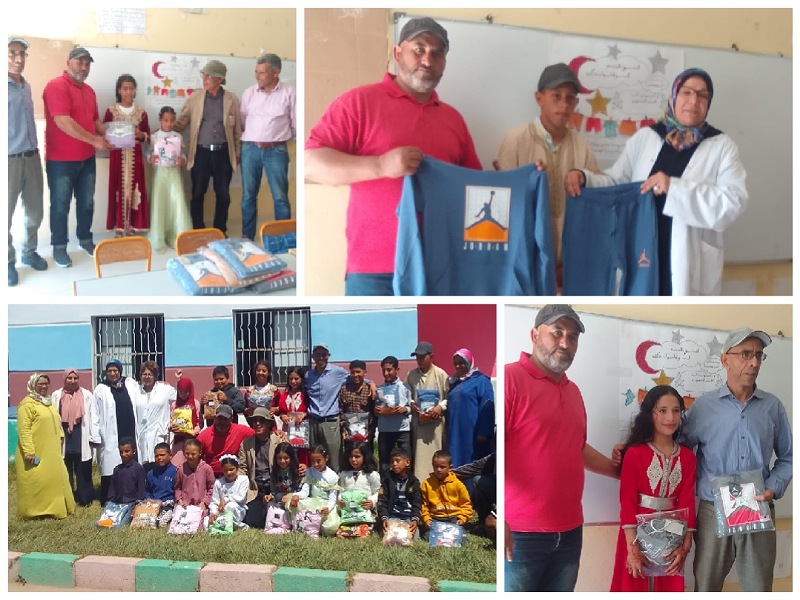 توزيع ملابس العيد  على تلاميذ الأسر المعوزة  بمجموعة مدارس أولاد المقدم بجماعة مولاي عبدالله